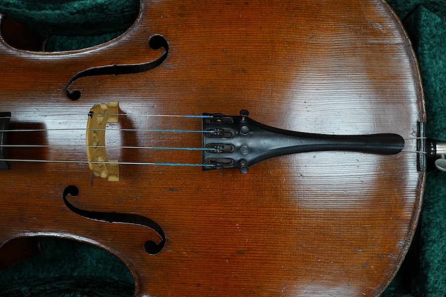 A cased late 19th century German? cello, body length 75cm, together with two bows. Condition - fair to good.